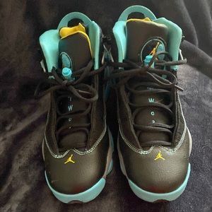 Air Jordans black and turquoise women’s size 8 youth size 7.